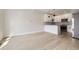 Spacious living room and kitchen combination with hardwood floors and great natural lighting at 1462 Yates St, Denver, CO 80204