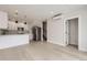 Bright living room and kitchen combination with hardwood floors and great natural lighting at 1462 Yates St, Denver, CO 80204