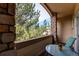Balcony with stone pillar and outdoor seating area with a view of the surrounding landscape at 22920 E Roxbury Dr # H, Aurora, CO 80016