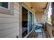 Balcony view showcasing outdoor seating, with sliding door access to the indoors at 22920 E Roxbury Dr # H, Aurora, CO 80016
