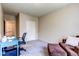 Study bedroom with an arm chair and ottoman at 22920 E Roxbury Dr # H, Aurora, CO 80016