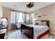 Inviting bedroom featuring a comfortable bed, soft lighting, and decorative wall art at 22920 E Roxbury Dr # H, Aurora, CO 80016