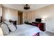 Comfortable bedroom with neutral walls, dark wood furniture, and decorative fan and lamps at 22920 E Roxbury Dr # H, Aurora, CO 80016