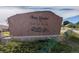 Elegant community entrance sign 'Moon Shadow at Saddle Rock' amidst landscaped greenery at 22920 E Roxbury Dr # H, Aurora, CO 80016