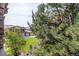 Exterior shot featuring beautiful landscaping and partial home view at 22920 E Roxbury Dr # H, Aurora, CO 80016