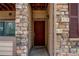 Exterior image of the front entrance, showcasing the door and surrounding facade at 22920 E Roxbury Dr # H, Aurora, CO 80016