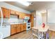 Functional kitchen with ample cabinet space, modern appliances, and a charming dining island at 22920 E Roxbury Dr # H, Aurora, CO 80016