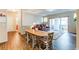 Bright and open living area with a dining table, comfortable seating, and access to a balcony at 22920 E Roxbury Dr # H, Aurora, CO 80016