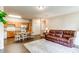 Bright open-concept living space with kitchen, dining, cozy furniture and hardwood flooring at 22920 E Roxbury Dr # H, Aurora, CO 80016