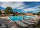 View of community pool area with lounge chairs and a lift at 22920 E Roxbury Dr # H, Aurora, CO 80016