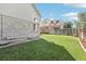Expansive backyard featuring a well-maintained lawn and a fence for privacy at 3982 S Himalaya Way, Aurora, CO 80013