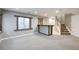 Spacious carpeted basement with bar and stair access at 3982 S Himalaya Way, Aurora, CO 80013