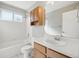 Bathroom featuring a shower-tub combo with a bright vanity and storage at 3982 S Himalaya Way, Aurora, CO 80013