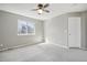 Carpeted bedroom featuring neutral walls, a ceiling fan, a window, and closet space at 3982 S Himalaya Way, Aurora, CO 80013