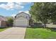 Inviting two-story home featuring a well-kept lawn and mature trees, creating a serene curb appeal at 3982 S Himalaya Way, Aurora, CO 80013