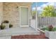 Charming front porch with decorative plants, creating a welcoming entrance to the home at 3982 S Himalaya Way, Aurora, CO 80013