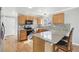 A kitchen with granite countertops, stainless steel appliances, and hardwood floors at 3982 S Himalaya Way, Aurora, CO 80013