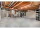 Spacious unfinished basement with open ceiling, concrete walls, and floor, presenting a blank canvas for future development at 7501 S Ivanhoe Cir, Centennial, CO 80112