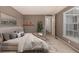 Neutral bedroom with large bed, decorative accents, and natural lighting at 7501 S Ivanhoe Cir, Centennial, CO 80112