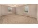Bright and spacious bedroom with two windows, offering ample natural light and a comfortable atmosphere at 7501 S Ivanhoe Cir, Centennial, CO 80112