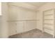 Walk-in closet with built-in shelving and ample storage space at 7501 S Ivanhoe Cir, Centennial, CO 80112