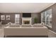 Spacious living room with a fireplace, neutral tones, and ample natural light at 7501 S Ivanhoe Cir, Centennial, CO 80112