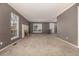 A large living room with large windows and a fireplace at 7501 S Ivanhoe Cir, Centennial, CO 80112