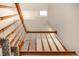 Close-up view of a carpeted staircase with a skylight above, providing natural light to the area at 7501 S Ivanhoe Cir, Centennial, CO 80112