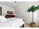 Bright bedroom featuring a wooden bed frame, neutral tones, and natural light streaming through the windows at 9307 Amison Cir # 202, Parker, CO 80134