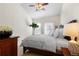 Comfortable bedroom with a well-lit interior, featuring a wooden bed frame and ample natural light at 9307 Amison Cir # 202, Parker, CO 80134