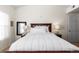 Cozy bedroom with a wooden bed frame, neutral tones, and natural light streaming through the windows at 9307 Amison Cir # 202, Parker, CO 80134