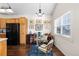Cozy dining area featuring hardwood floors, wood cabinetry, and a flood of natural light at 9307 Amison Cir # 202, Parker, CO 80134