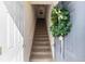 Inviting entryway featuring a staircase adorned with a decorative wreath on the front door at 9307 Amison Cir # 202, Parker, CO 80134