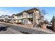 Beautiful townhome with stone accents, private balconies, and well-maintained landscaping at 9307 Amison Cir # 202, Parker, CO 80134