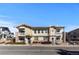 Exterior view of a tan condo with nice stone columns and trim at 9307 Amison Cir # 202, Parker, CO 80134