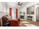 Bright living room featuring a cozy fireplace, comfortable seating, and natural light at 9307 Amison Cir # 202, Parker, CO 80134