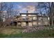 Back of home features large windows, a deck, and a walkout basement for natural light at 5631 Silver Bluff Ct, Parker, CO 80134