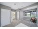 Finished basement bedroom with neutral tones, a large window, and an attached bathroom for added convenience at 5631 Silver Bluff Ct, Parker, CO 80134