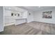 Comfortable finished basement with a kitchenette featuring white cabinetry, countertops and an open layout at 5631 Silver Bluff Ct, Parker, CO 80134