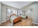 Cozy bedroom with a classic wooden bed frame and a mirrored closet at 5631 Silver Bluff Ct, Parker, CO 80134