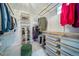 Walk-in closet with custom shelving, shoe racks, and ample storage space at 5631 Silver Bluff Ct, Parker, CO 80134