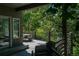 Relaxing outdoor deck with seating area and views of the lush green backyard at 5631 Silver Bluff Ct, Parker, CO 80134