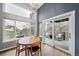 Bright dining room with patio access, showcasing natural light and modern finishes at 5631 Silver Bluff Ct, Parker, CO 80134