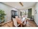 Formal dining room featuring a large table, elegant chairs, and ample natural light at 5631 Silver Bluff Ct, Parker, CO 80134