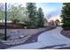 Long driveway leads to this beautiful home, surrounded by mature trees and professional landscaping at 5631 Silver Bluff Ct, Parker, CO 80134