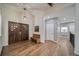 Welcoming foyer featuring hardwood floors, a decorative front door, and stylish lighting fixtures at 5631 Silver Bluff Ct, Parker, CO 80134