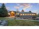 Beautiful front exterior with well-lit facade, arched entryway, and landscaped front yard at 5631 Silver Bluff Ct, Parker, CO 80134