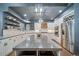 Bright kitchen features white cabinets, granite countertops, stainless steel appliances, and a large center island at 5631 Silver Bluff Ct, Parker, CO 80134
