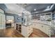 Bright and spacious kitchen featuring a large island, custom cabinetry, and modern appliances at 5631 Silver Bluff Ct, Parker, CO 80134