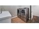 Convenient laundry room with modern washer, dryer, and ample storage space at 5631 Silver Bluff Ct, Parker, CO 80134